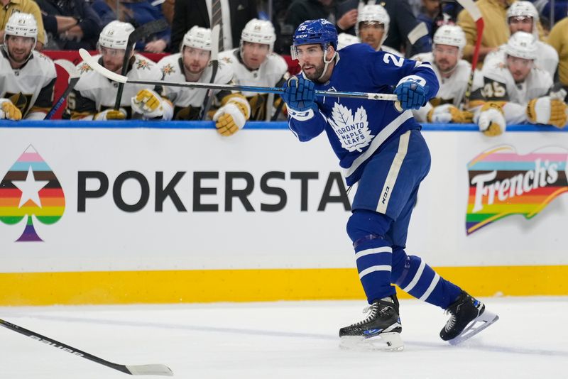 Nov 20, 2024; Toronto, Ontario, CAN; Toronto Maple Leafs defenceman Conor Timmins (25) shoots against the Vegas Golden Knights during the first period at Scotiabank Arena. Mandatory Credit: John E. Sokolowski-Imagn Images