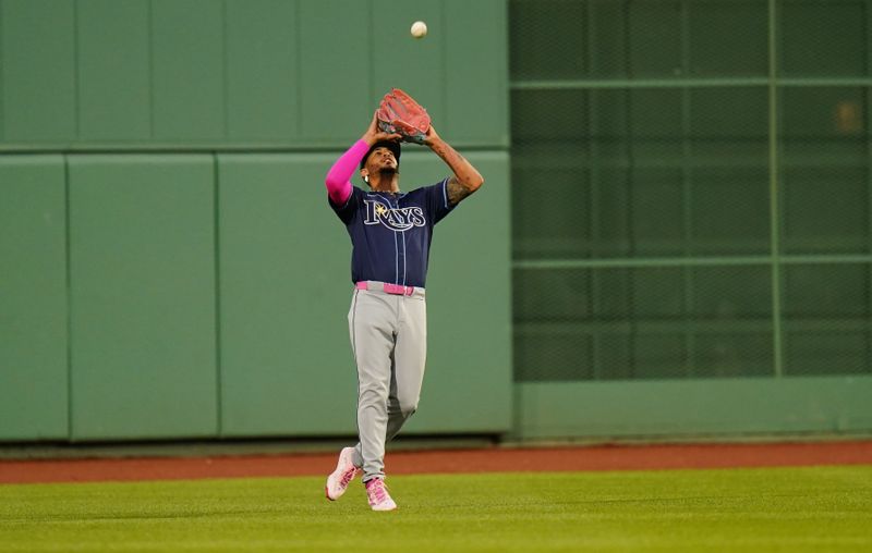 May 13, 2024; Boston, Massachusetts, USA; Tampa Bay Rays center fielder Jose Siri (22) makes the play against the Boston Red Sox in the second inning at Fenway Park. Mandatory Credit: David Butler II-USA TODAY Sports