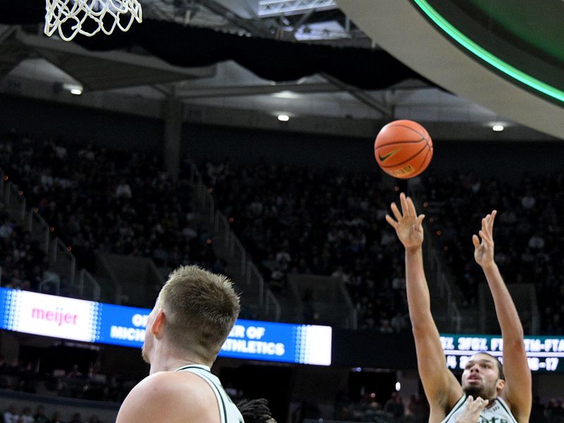 Dec 2, 2025; East Lansing, Michigan, USA;  Michigan State Spartans forward Jesse McCulloch (35) shoots a jump shot during the second half against the Iowa Hawkeyes at Jack Breslin Student Events Center. Mandatory Credit: Dale Young-Imagn Images