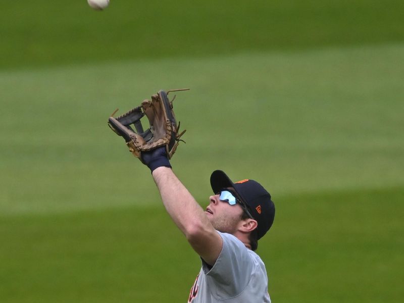 Oct 12, 2024; Cleveland, Ohio, USA; Detroit Tigers second base Colt Keith (33) makes a catch in the fourth inning against the Cleveland Guardians during game five of the ALDS for the 2024 MLB Playoffs at Progressive Field. Mandatory Credit: David Richard-Imagn Images
