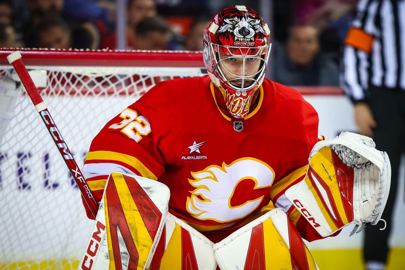 Nov 11, 2024; Calgary, Alberta, CAN; Calgary Flames goaltender Dustin Wolf (32) guards his net against the Los Angeles Kings during the first period at Scotiabank Saddledome. Mandatory Credit: Sergei Belski-Imagn Images