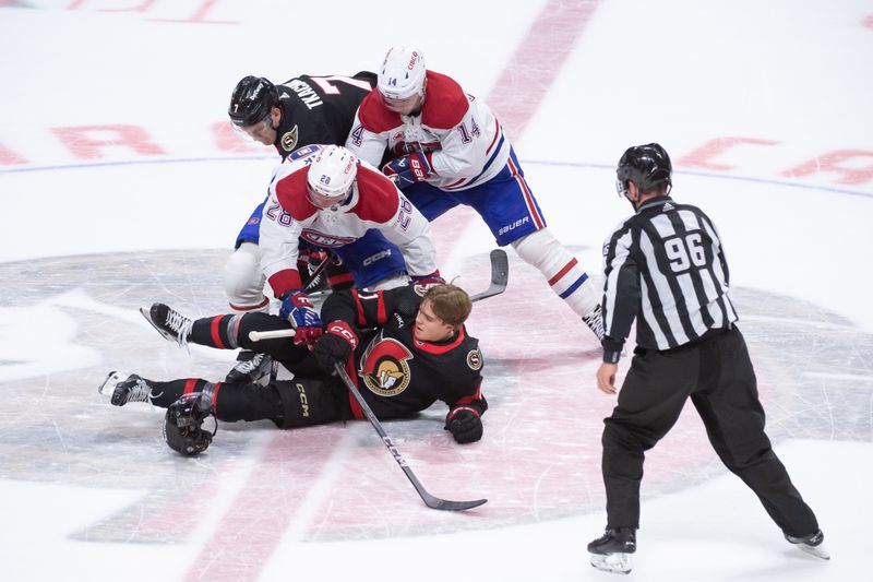 Apr 13, 2024; Ottawa, Ontario, CAN; Ottawa Senators center Ridly Greig (71) loses his helmet following a faceoff against Montreal Canadiens center Christian Dvorak (28) in the third period at the Canadian Tire Centre. Mandatory Credit: Marc DesRosiers-USA TODAY Sports