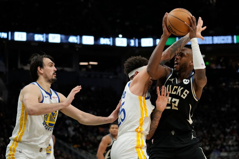 MILWAUKEE, WISCONSIN - JANUARY 13: Lester Quinones #25 of the Golden State Warriors fouls Khris Middleton #22 of the Milwaukee Bucks in the second half at Fiserv Forum on January 13, 2024 in Milwaukee, Wisconsin. NOTE TO USER: User expressly acknowledges and agrees that, by downloading and or using this photograph, User is consenting to the terms and conditions of the Getty Images License Agreement. (Photo by Patrick McDermott/Getty Images)