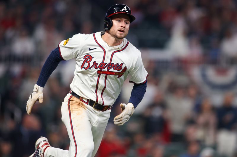 Apr 6, 2024; Atlanta, Georgia, USA; Atlanta Braves left fielder Jarred Kelenic (24) hits a double against the Arizona Diamondbacks in the eighth inning at Truist Park. Mandatory Credit: Brett Davis-USA TODAY Sports
