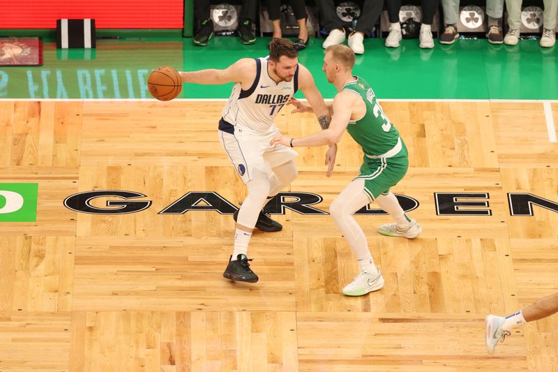 BOSTON, MA - JUNE 17: Sam Hauser #30 of the Boston Celtics plays defense during the game  against Luka Doncic #77 of the Dallas Mavericks during Game 5 of the 2024 NBA Finals on June 17, 2024 at the TD Garden in Boston, Massachusetts. NOTE TO USER: User expressly acknowledges and agrees that, by downloading and or using this photograph, User is consenting to the terms and conditions of the Getty Images License Agreement. Mandatory Copyright Notice: Copyright 2024 NBAE  (Photo by Stephen Gosling/NBAE via Getty Images)