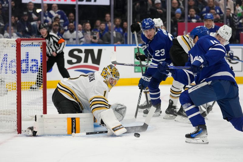 Apr 24, 2024; Toronto, Ontario, CAN; Boston Bruins goaltender Jeremy Swayman (1) makes a save on Toronto Maple Leafs forward Calle Jarnkrok (19) as forward Matthew Knies (23) looks on during the first period of game three of the first round of the 2024 Stanley Cup Playoffs at Scotiabank Arena. Mandatory Credit: John E. Sokolowski-USA TODAY Sports