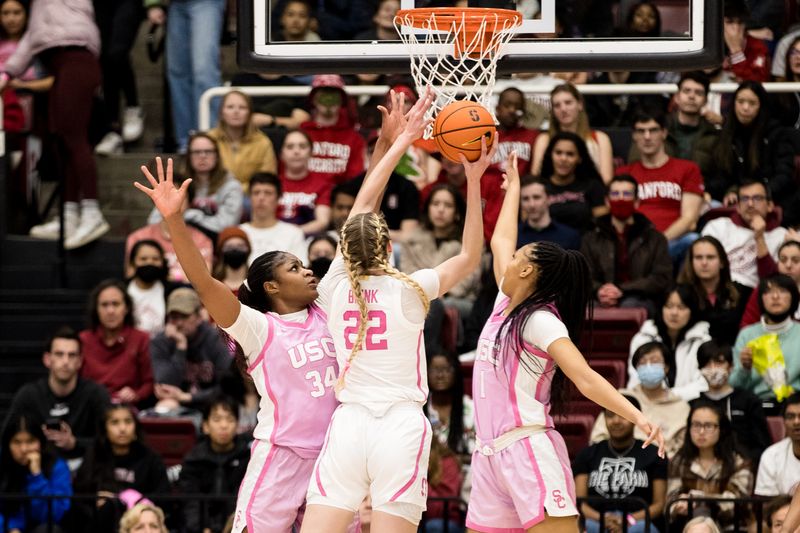 Feb 17, 2023; Stanford, California, USA;  USC Trojans guard Taylor Bigby (1) and center Clarice Akunwafo (34) defend against a shot by Stanford Cardinal forward Cameron Brink (22) during the first half at Maples Pavilion. Mandatory Credit: John Hefti-USA TODAY Sports