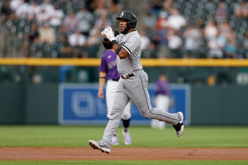 Aug 18, 2023; Denver, Colorado, USA; Chicago White Sox shortstop Elvis Andrus (1) gestures as he rounds the bases on a solo home run in the first inning against the Colorado Rockies at Coors Field. Mandatory Credit: Isaiah J. Downing-USA TODAY Sports