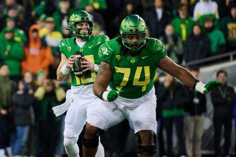 Nov 24, 2023; Eugene, Oregon, USA; Oregon Ducks quarterback Bo Nix (10) drops back for a pass during the second half against the Oregon State Beavers at Autzen Stadium. Mandatory Credit: Troy Wayrynen-USA TODAY Sports