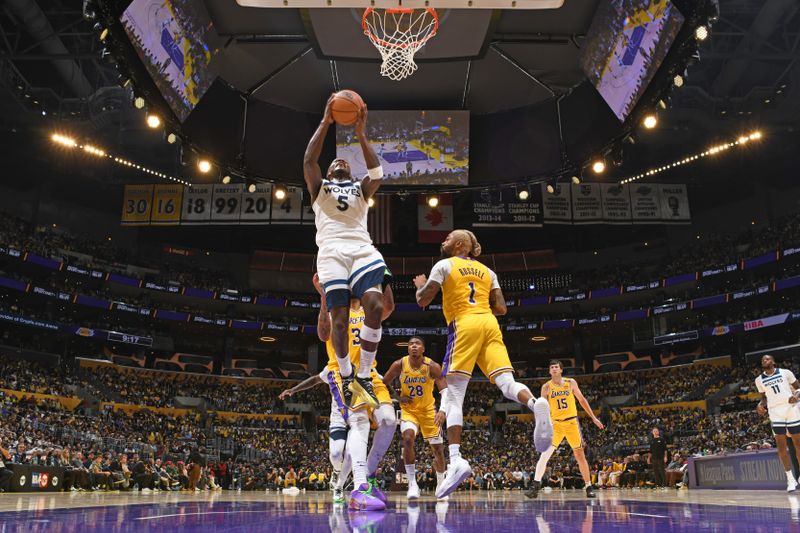 LOS ANGELES, CA - OCTOBER 22: Anthony Edwards #5 of the Minnesota Timberwolves drives to the basket during the game against the Los Angeles Lakers on October 22, 2024 at Crypto.Com Arena in Los Angeles, California. NOTE TO USER: User expressly acknowledges and agrees that, by downloading and/or using this Photograph, user is consenting to the terms and conditions of the Getty Images License Agreement. Mandatory Copyright Notice: Copyright 2024 NBAE (Photo by Adam Pantozzi/NBAE via Getty Images)