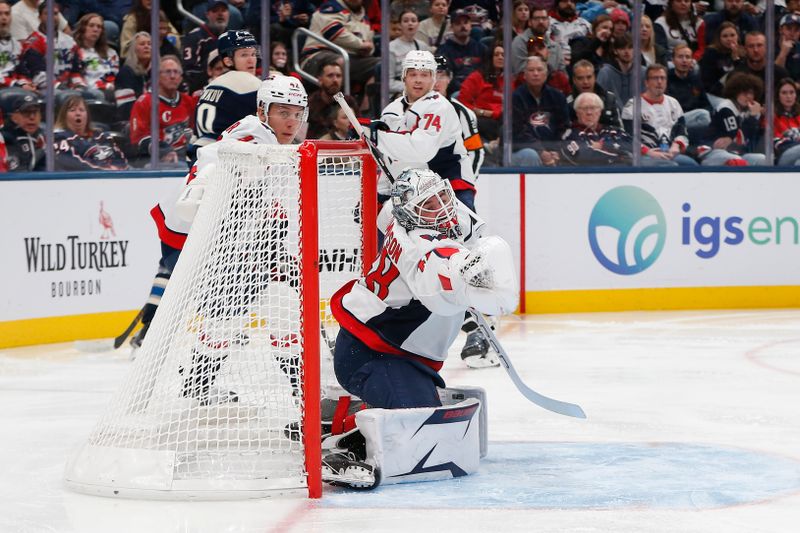 Oct 24, 2025; Columbus, Ohio, USA; Washington Capitals goalie Logan Thompson (48) makes a glove save against the Columbus Blue Jackets during the second period at Nationwide Arena. Mandatory Credit: Russell LaBounty-Imagn Images
