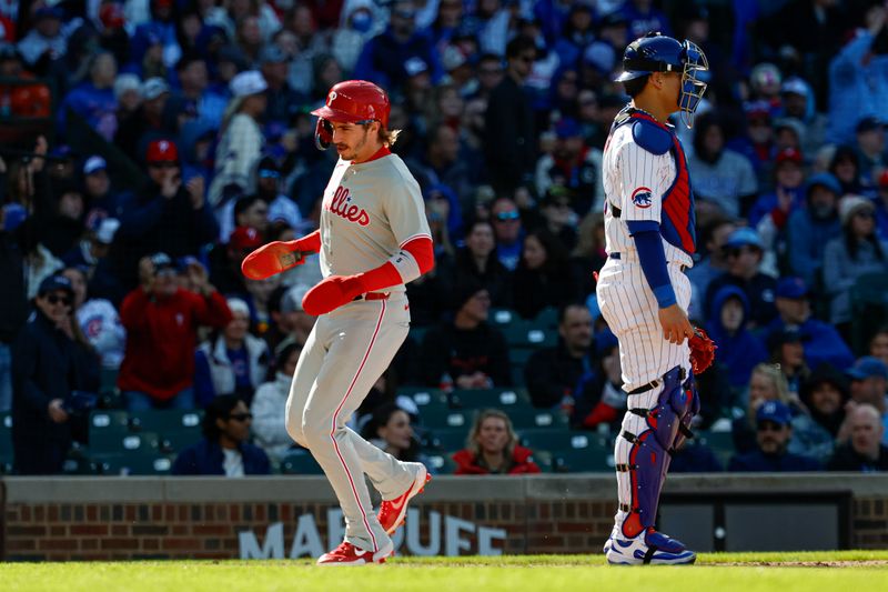 Apr 26, 2025; Chicago, Illinois, USA; Philadelphia Phillies second baseman Bryson Stott (5) scores against the Chicago Cubs during the fourth inning at Wrigley Field. Mandatory Credit: Kamil Krzaczynski-Imagn Images