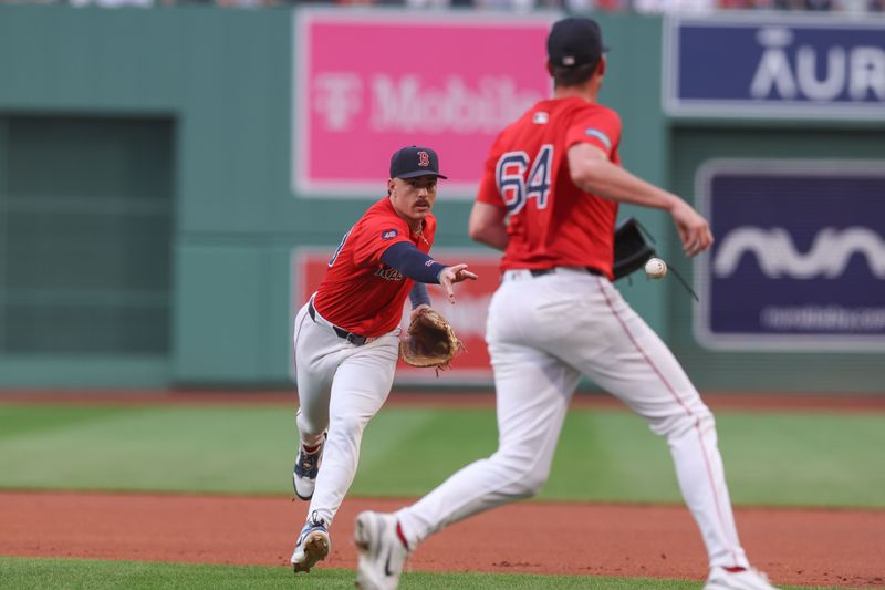 Jul 12, 2024; Boston, Massachusetts, USA; Boston Red Sox first baseman Romy Gonzalez (23) throws the ball to Boston Red Sox starting pitcher Cooper Criswell (64) during the first inning against the Kansas City Royals at Fenway Park. Mandatory Credit: Paul Rutherford-USA TODAY Sports