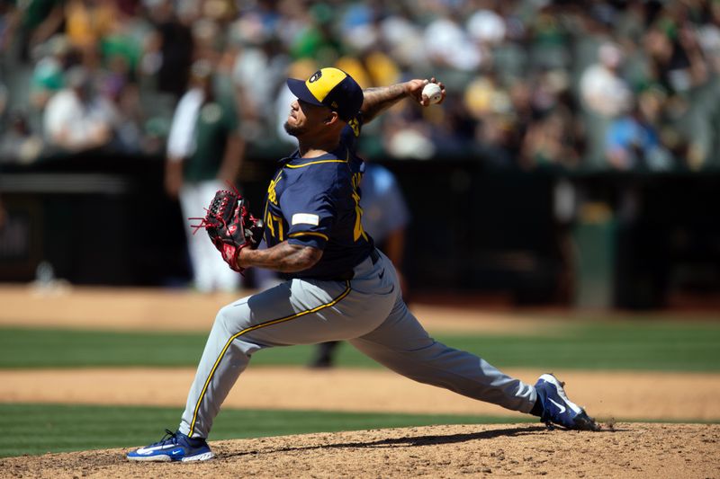 Aug 25, 2024; Oakland, California, USA; Milwaukee Brewers starting pitcher Frankie Montas (47) delivers a pitch against the Oakland Athletics during the sixth inning at Oakland-Alameda County Coliseum. Mandatory Credit: D. Ross Cameron-USA TODAY Sports