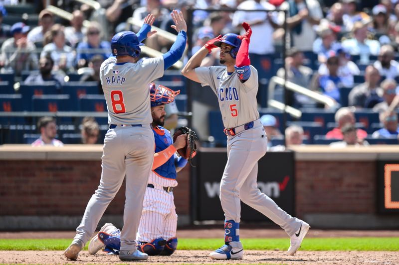 May 2, 2024; New York City, New York, USA; Chicago Cubs third baseman Christopher Morel (5) is greeted at home plate by Chicago Cubs outfielder Ian Happ (8) after hitting a three run home run against the New York Mets during the fifth inning at Citi Field. Mandatory Credit: John Jones-USA TODAY Sports