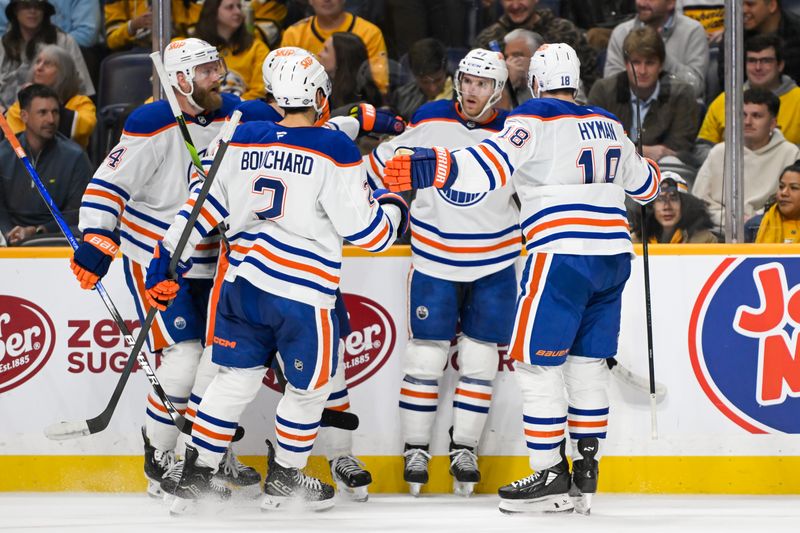 Oct 17, 2024; Nashville, Tennessee, USA;  dEdmonton Oilers center Connor McDavid (97) celebrates his goal with his teammates  against the Nashville Predators uring the second period at Bridgestone Arena. Mandatory Credit: Steve Roberts-Imagn Images