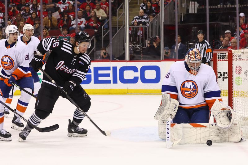 Apr 15, 2024; Newark, New Jersey, USA; New York Islanders goaltender Semyon Varlamov (40) makes a save against the New Jersey Devils during the second period at Prudential Center. Mandatory Credit: Ed Mulholland-USA TODAY Sports