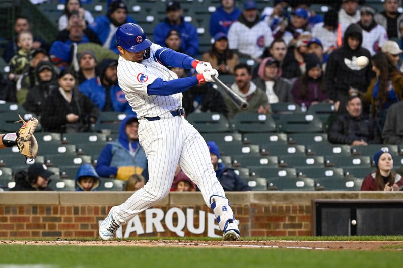 Apr 2, 2024; Chicago, Illinois, USA; Chicago Cubs right fielder Seiya Suzuki (27) hits a two-run home run against the Colorado Rockies during the first inning at Wrigley Field. Mandatory Credit: Matt Marton-USA TODAY Sports