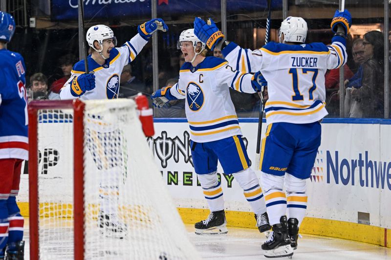 Nov 7, 2024; New York, New York, USA;  Buffalo Sabres center Ryan McLeod (71) and left wing Jason Zucker (17) celebrate the goal by defenseman Rasmus Dahlin (26) against the New York Rangers during the first period at Madison Square Garden. Mandatory Credit: Dennis Schneidler-Imagn Images