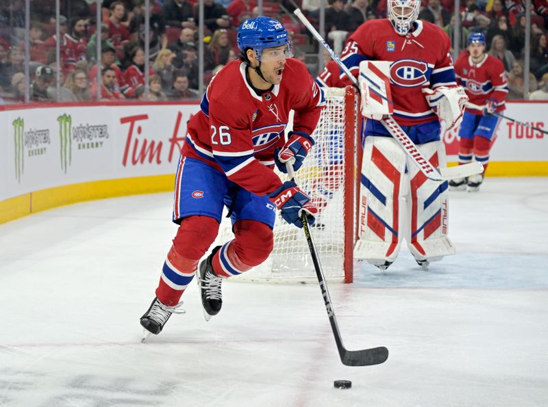 Feb 10, 2024; Montreal, Quebec, CAN; Montreal Canadiens defenseman Johnathan Kovacevic (26) controls the puck against the Dallas Stars during the first period at the Bell Centre. Mandatory Credit: Eric Bolte-USA TODAY Sports