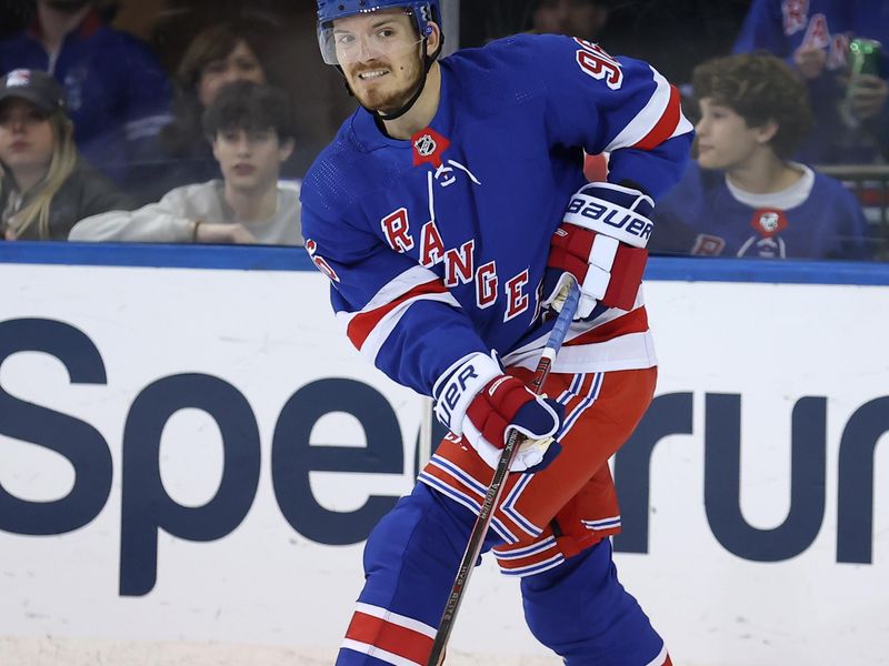 Mar 11, 2024; New York, New York, USA; New York Rangers center Jack Roslovic (96) plays the puck against the New Jersey Devils during the third period at Madison Square Garden. Mandatory Credit: Brad Penner-USA TODAY Sports