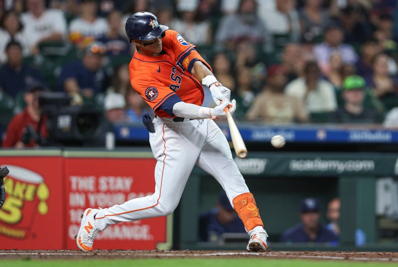 Aug 2, 2024; Houston, Texas, USA; Houston Astros shortstop Jeremy Pena (3) hits a single during the second inning against the Tampa Bay Rays at Minute Maid Park. Mandatory Credit: Troy Taormina-USA TODAY Sports