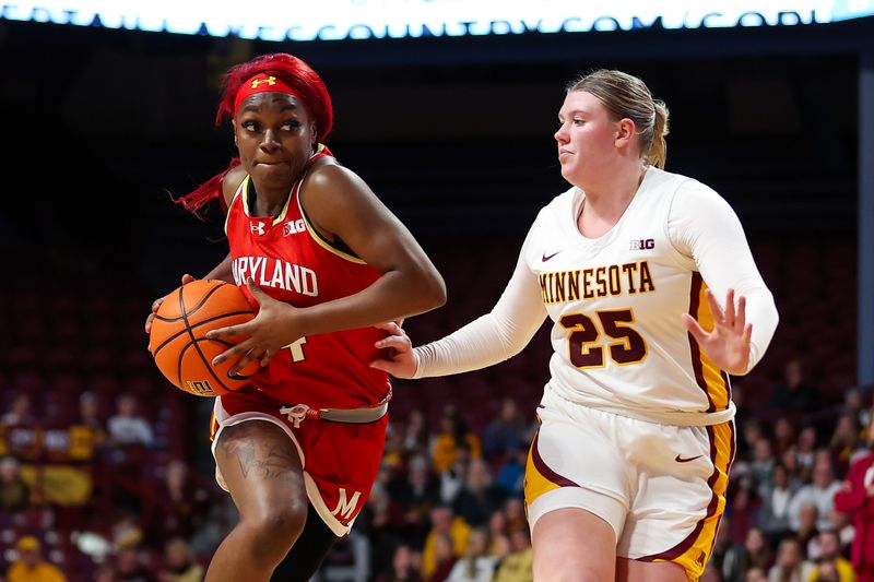 Jan 3, 2024; Minneapolis, Minnesota, USA; Maryland Terrapins guard Bri McDaniel (24) works toward the basket as Minnesota Golden Gophers guard Grace Grocholski (25) defends during the second half at Williams Arena. Mandatory Credit: Matt Krohn-USA TODAY Sports