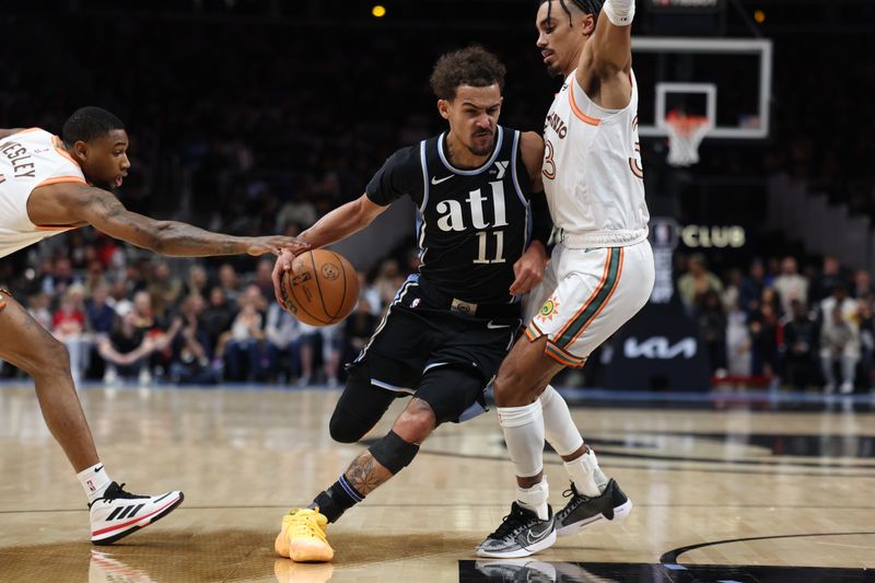 ATLANTA, GA - JANUARY 15: Trae Young #11 of the Atlanta Hawks handles the ball during the game against the San Antonio Spurs on January 15, 2024 at State Farm Arena in Atlanta, Georgia.  NOTE TO USER: User expressly acknowledges and agrees that, by downloading and/or using this Photograph, user is consenting to the terms and conditions of the Getty Images License Agreement. Mandatory Copyright Notice: Copyright 2024 NBAE (Photo by Mercedes Oliver/NBAE via Getty Images)