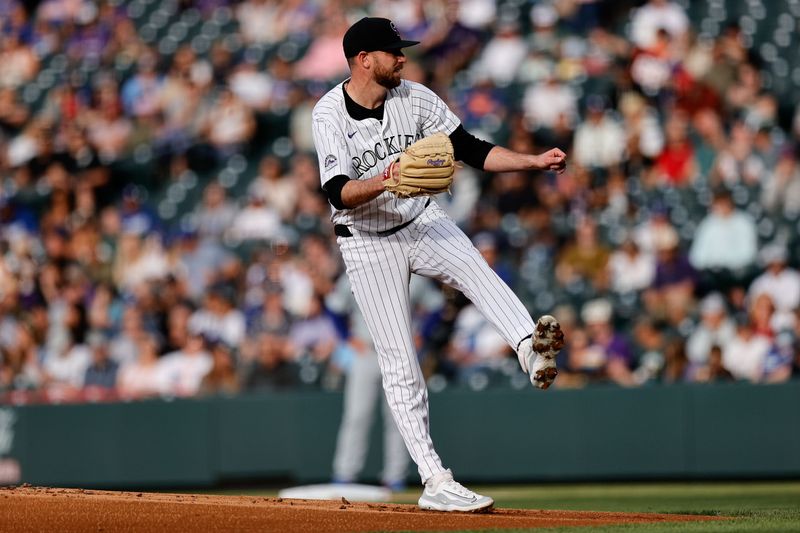 Jun 18, 2024; Denver, Colorado, USA; Colorado Rockies starting pitcher Austin Gomber (26) pitches in the first inning against the Los Angeles Dodgers at Coors Field. Mandatory Credit: Isaiah J. Downing-USA TODAY Sports