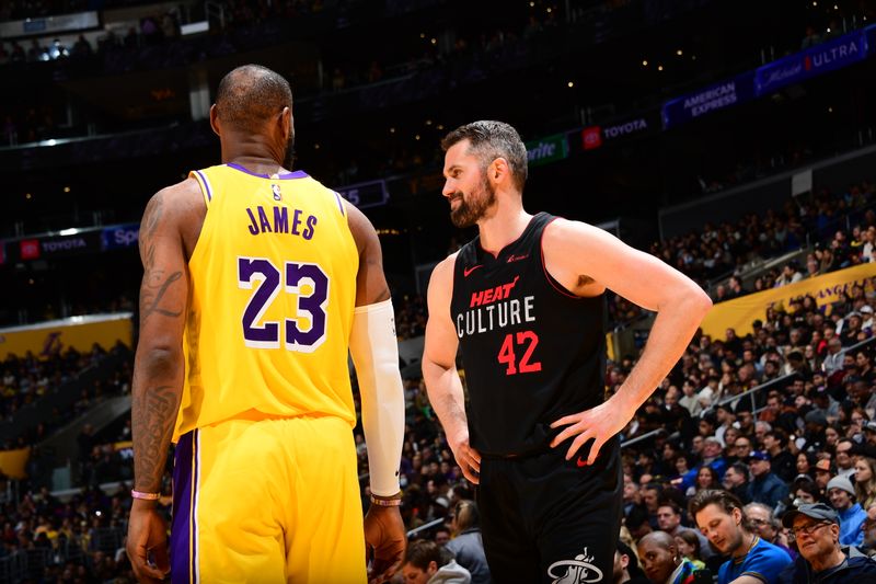 LOS ANGELES, CA - JANUARY 3: LeBron James #23 of the Los Angeles Lakers talks with former teammate Kevin Love #42 of the Miami Heat during the game on January 3, 2024 at Crypto.Com Arena in Los Angeles, California. NOTE TO USER: User expressly acknowledges and agrees that, by downloading and/or using this Photograph, user is consenting to the terms and conditions of the Getty Images License Agreement. Mandatory Copyright Notice: Copyright 2024 NBAE (Photo by Adam Pantozzi/NBAE via Getty Images)