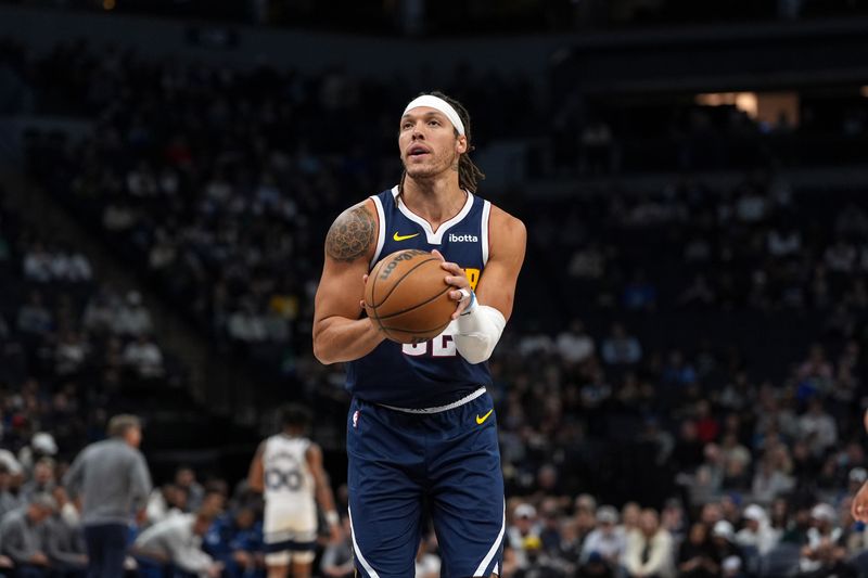 MINNEAPOLIS, MN - OCTOBER 17: Aaron Gordon #32 of the Denver Nuggets prepares to shoot a free throw during the game against the Minnesota Timberwolves during a NBA Preseason game on October 17, 2024 at Target Center in Minneapolis, Minnesota. NOTE TO USER: User expressly acknowledges and agrees that, by downloading and or using this Photograph, user is consenting to the terms and conditions of the Getty Images License Agreement. Mandatory Copyright Notice: Copyright 2024 NBAE (Photo by Jordan Johnson/NBAE via Getty Images)