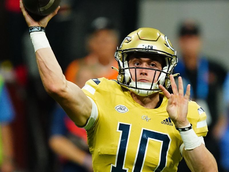 Sep 1, 2023; Atlanta, Georgia, USA; Georgia Tech Yellow Jackets quarterback Haynes King (10) passing against the Louisville Cardinals during the second half at Mercedes-Benz Stadium. Mandatory Credit: John David Mercer-USA TODAY Sports