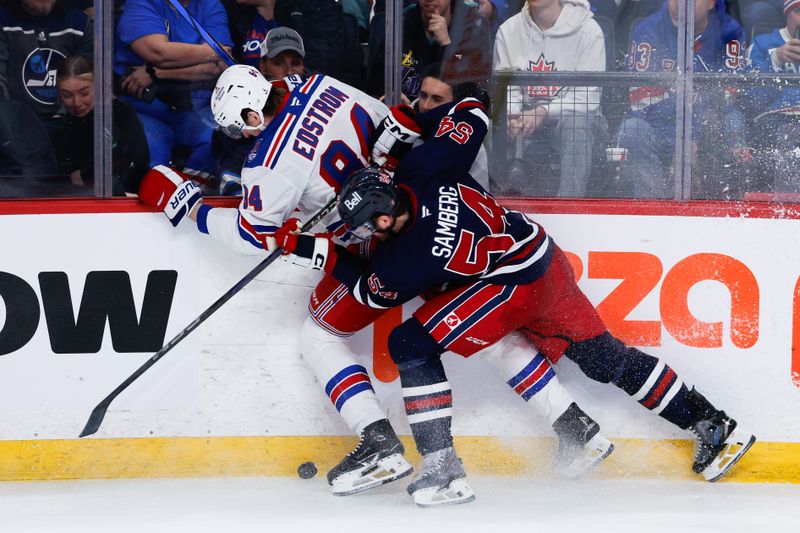 Mar 12, 2026; Winnipeg, Manitoba, CAN; Winnipeg Jets defenseman Dylan Samberg (54) checks New York Rangers forward Adam Edstrom (84)  during the third period at Canada Life Centre. Mandatory Credit: Terrence Lee-Imagn Images