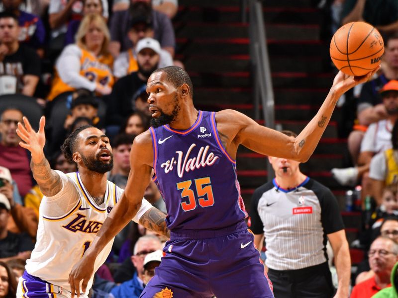 PHOENIX, AZ - FEBRUARY 25: Kevin Durant #35 of the Phoenix Suns handles the ball during the game against the Los Angeles Lakers on February 25, 2024 at Footprint Center in Phoenix, Arizona. NOTE TO USER: User expressly acknowledges and agrees that, by downloading and or using this photograph, user is consenting to the terms and conditions of the Getty Images License Agreement. Mandatory Copyright Notice: Copyright 2024 NBAE (Photo by Barry Gossage/NBAE via Getty Images)