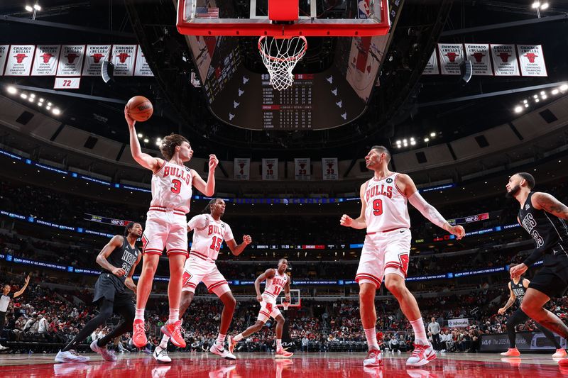 CHICAGO, IL - DECEMBER 2: Josh Giddey #3 of the Chicago Bulls rebounds the ball during the game against the Brooklyn Nets on December 2, 2024 at United Center in Chicago, Illinois. NOTE TO USER: User expressly acknowledges and agrees that, by downloading and or using this photograph, User is consenting to the terms and conditions of the Getty Images License Agreement. Mandatory Copyright Notice: Copyright 2024 NBAE (Photo by Jeff Haynes/NBAE via Getty Images)