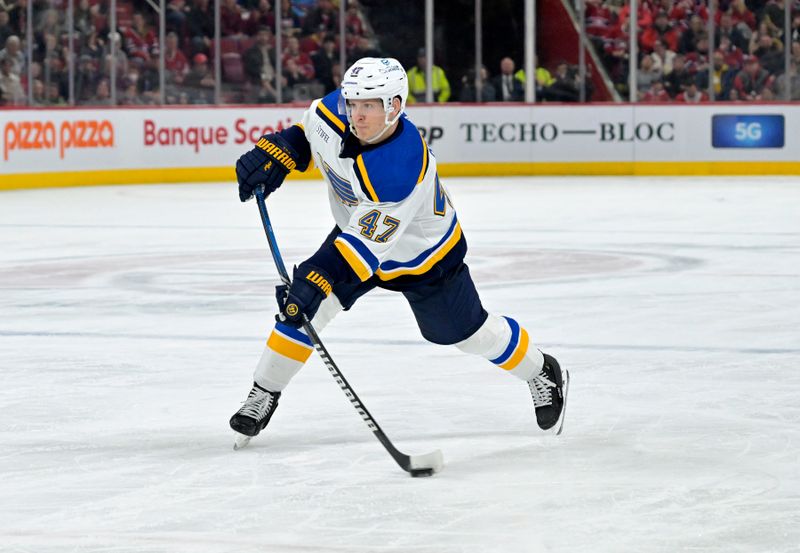 Feb 11, 2024; Montreal, Quebec, CAN;  St.Louis Blues defenseman Torey Krug (47) takes a shot on net during the third period of the game against the Montreal Canadiens at the Bell Centre. Mandatory Credit: Eric Bolte-USA TODAY Sports