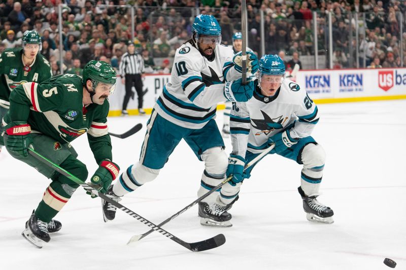 Mar 3, 2024; Saint Paul, Minnesota, USA; San Jose Sharks left wing Anthony Duclair (10) and left wing Fabian Zetterlund (20) battle Minnesota Wild defenseman Jake Middleton (5) for a loose puck in the third period at Xcel Energy Center. Mandatory Credit: Matt Blewett-USA TODAY Sports