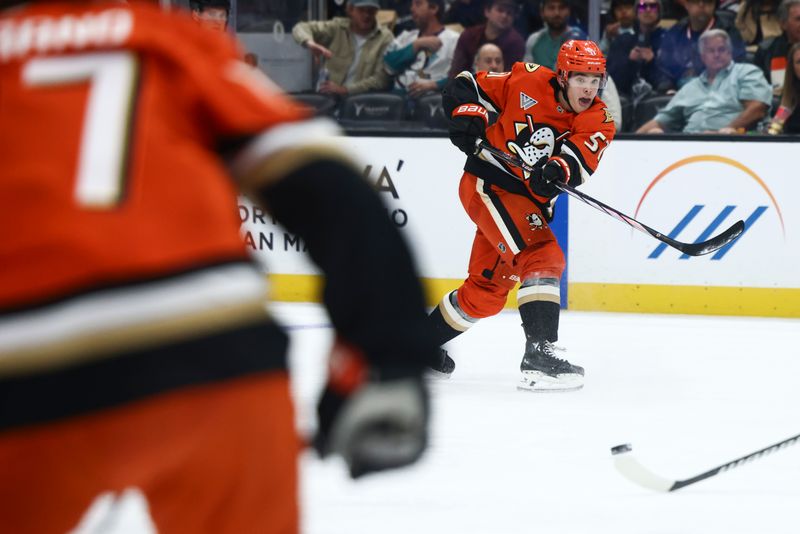 Nov 8, 2024; Anaheim, California, USA; Anaheim Ducks defenseman Olen Zellweger (51) passes the puck during the second period against the Minnesota Wild at Honda Center. Mandatory Credit: Jessica Alcheh-Imagn Images