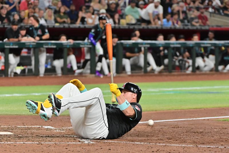 Jul 10, 2024; Phoenix, Arizona, USA;  Arizona Diamondbacks designated hitter Joc Pederson (3) is hit by a pitch in the eighth inning against the Atlanta Braves at Chase Field. Mandatory Credit: Matt Kartozian-USA TODAY Sports