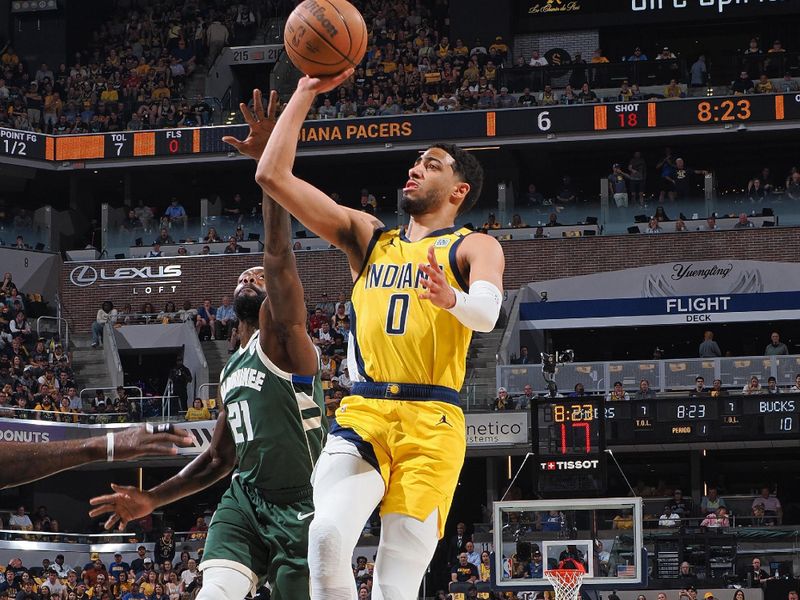 INDIANAPOLIS, IN - APRIL 28: Tyrese Haliburton #0 of the Indiana Pacers shoots the ball during the game against the Milwaukee Bucks during Round 1 Game 4 of the 2024 NBA Playoffs on April 28, 2024 at Gainbridge Fieldhouse in Indianapolis, Indiana. NOTE TO USER: User expressly acknowledges and agrees that, by downloading and or using this Photograph, user is consenting to the terms and conditions of the Getty Images License Agreement. Mandatory Copyright Notice: Copyright 2024 NBAE (Photo by Ron Hoskins/NBAE via Getty Images)