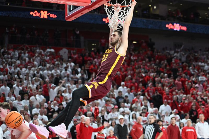 Mar 1, 2025; Lincoln, Nebraska, USA; Minnesota Golden Gophers forward Parker Fox (23) dunks against the Nebraska Cornhuskers during the second half at Pinnacle Bank Arena. Mandatory Credit: Steven Branscombe-Imagn Images