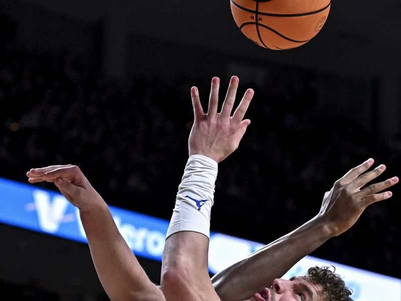 Feb 7, 2026; College Station, Texas, USA; Florida Gators center Micah Handlogten (3) is fouled by Texas A&M Aggies forward Jamie Vinson (4) during the first half at Reed Arena. Mandatory Credit: Maria Lysaker-Imagn Images 