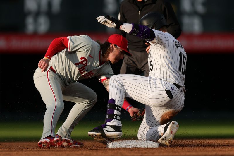 May 24, 2024; Denver, Colorado, USA; Colorado Rockies right fielder Hunter Goodman (15) slides safely into second agains tPhiladelphia Phillies second baseman Bryson Stott (5) on a double in the fifth inning at Coors Field. Mandatory Credit: Isaiah J. Downing-USA TODAY Sports