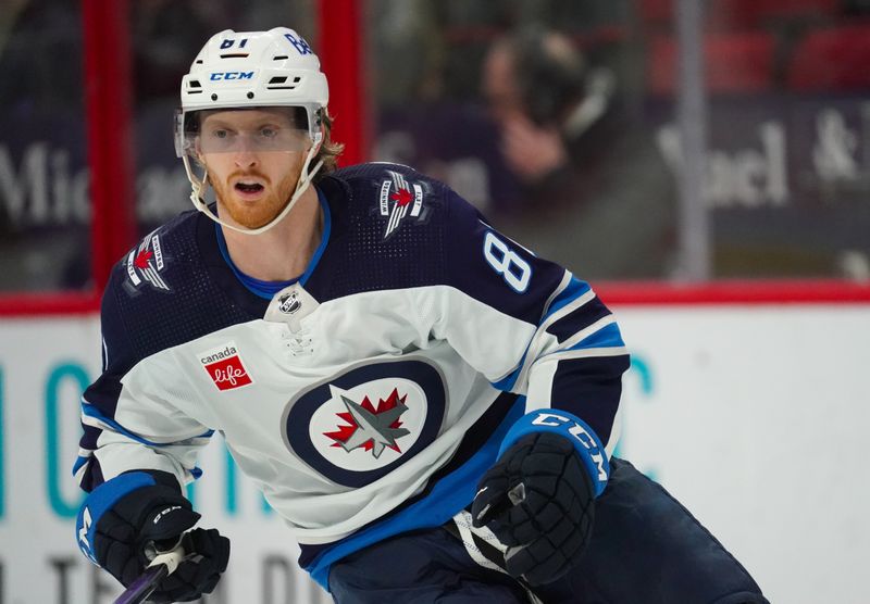 Mar 2, 2024; Raleigh, North Carolina, USA; Winnipeg Jets left wing Kyle Connor (81) skates against the Carolina Hurricanes during the third period at PNC Arena. Mandatory Credit: James Guillory-USA TODAY Sports