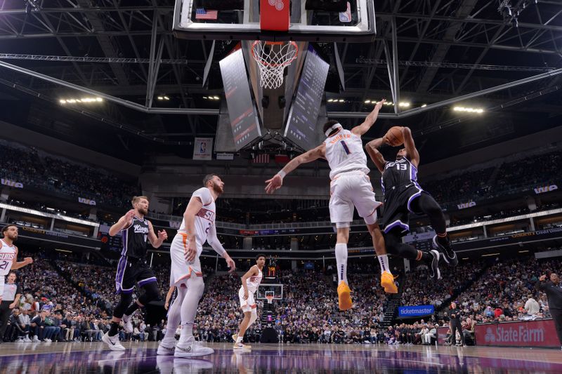 SACRAMENTO, CA - NOVEMBER 13: Keegan Murray #13 of the Sacramento Kings drives to the basket during the game against the Phoenix Suns on November 13, 2024 at Golden 1 Center in Sacramento, California. NOTE TO USER: User expressly acknowledges and agrees that, by downloading and or using this Photograph, user is consenting to the terms and conditions of the Getty Images License Agreement. Mandatory Copyright Notice: Copyright 2024 NBAE (Photo by Rocky Widner/NBAE via Getty Images)