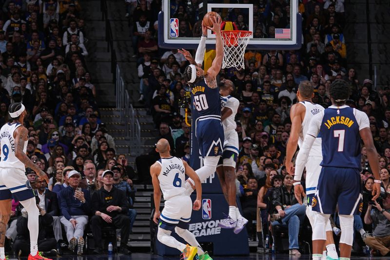 DENVER, CO - APRIL 10: Aaron Gordon #50 of the Denver Nuggets dunks the ball during the game against the Minnesota Timberwolves  on April 10, 2024 at the Ball Arena in Denver, Colorado. NOTE TO USER: User expressly acknowledges and agrees that, by downloading and/or using this Photograph, user is consenting to the terms and conditions of the Getty Images License Agreement. Mandatory Copyright Notice: Copyright 2024 NBAE (Photo by Bart Young/NBAE via Getty Images)