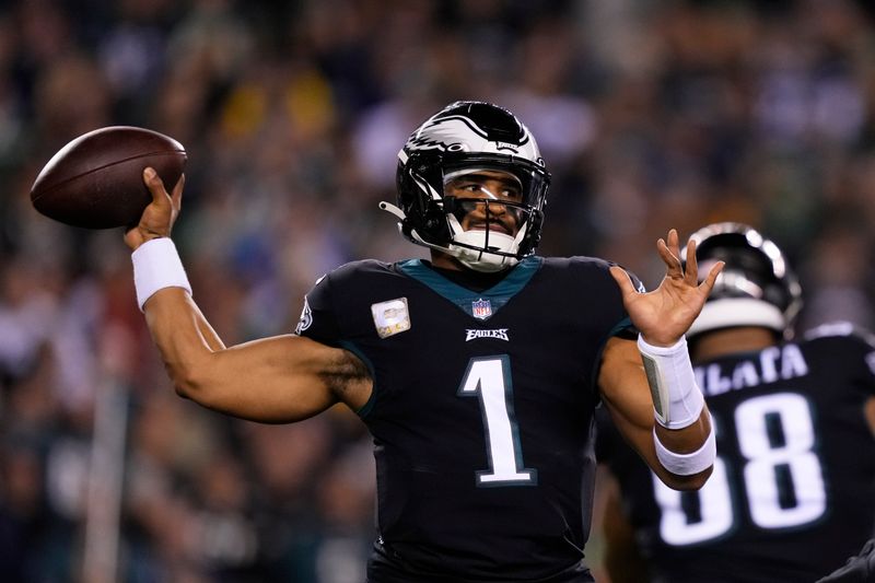 Philadelphia Eagles quarterback Jalen Hurts (1) throws during the first half of an NFL football game against the Green Bay Packers, Sunday, Nov. 27, 2022, in Philadelphia. (AP Photo/Matt Slocum)