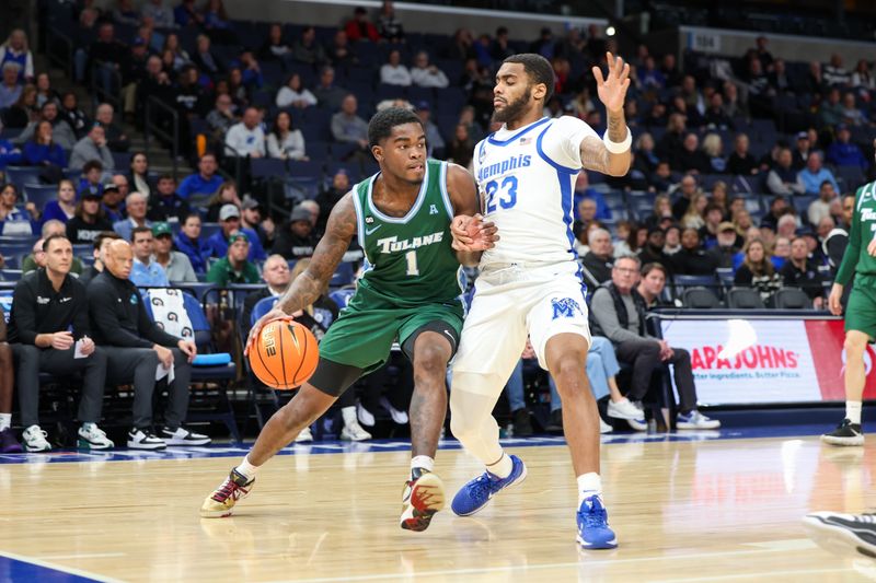 Feb 1, 2026; Memphis, Tennessee, USA; Tulane Green Wave guard Josiah Moore (1) drives against Memphis Tigers guard Sincere Parker (23) during the second half at FedExForum. Mandatory Credit: Wesley Hale-Imagn Images