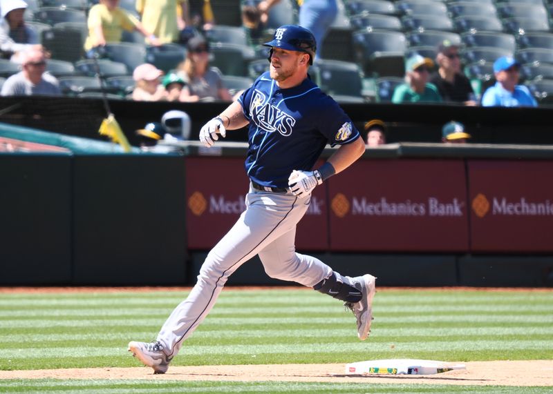 Jun 15, 2023; Oakland, California, USA; Tampa Bay Rays shortstop Wander Franco (5)5 rounds the bases on a solo home run against the Oakland Athletics during the eighth inning at Oakland-Alameda County Coliseum. Mandatory Credit: Kelley L Cox-USA TODAY Sports