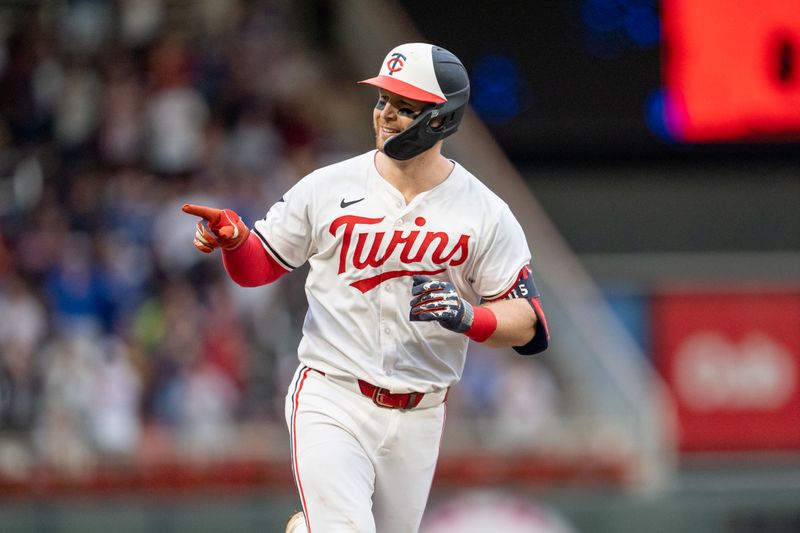 Jul 4, 2024; Minneapolis, Minnesota, USA; Minnesota Twins catcher Ryan Jeffers (27) reacts as he rounds the bases after hitting a home run against the Detroit Tigers in the fourth inning at Target Field. Mandatory Credit: Matt Blewett-USA TODAY Sports